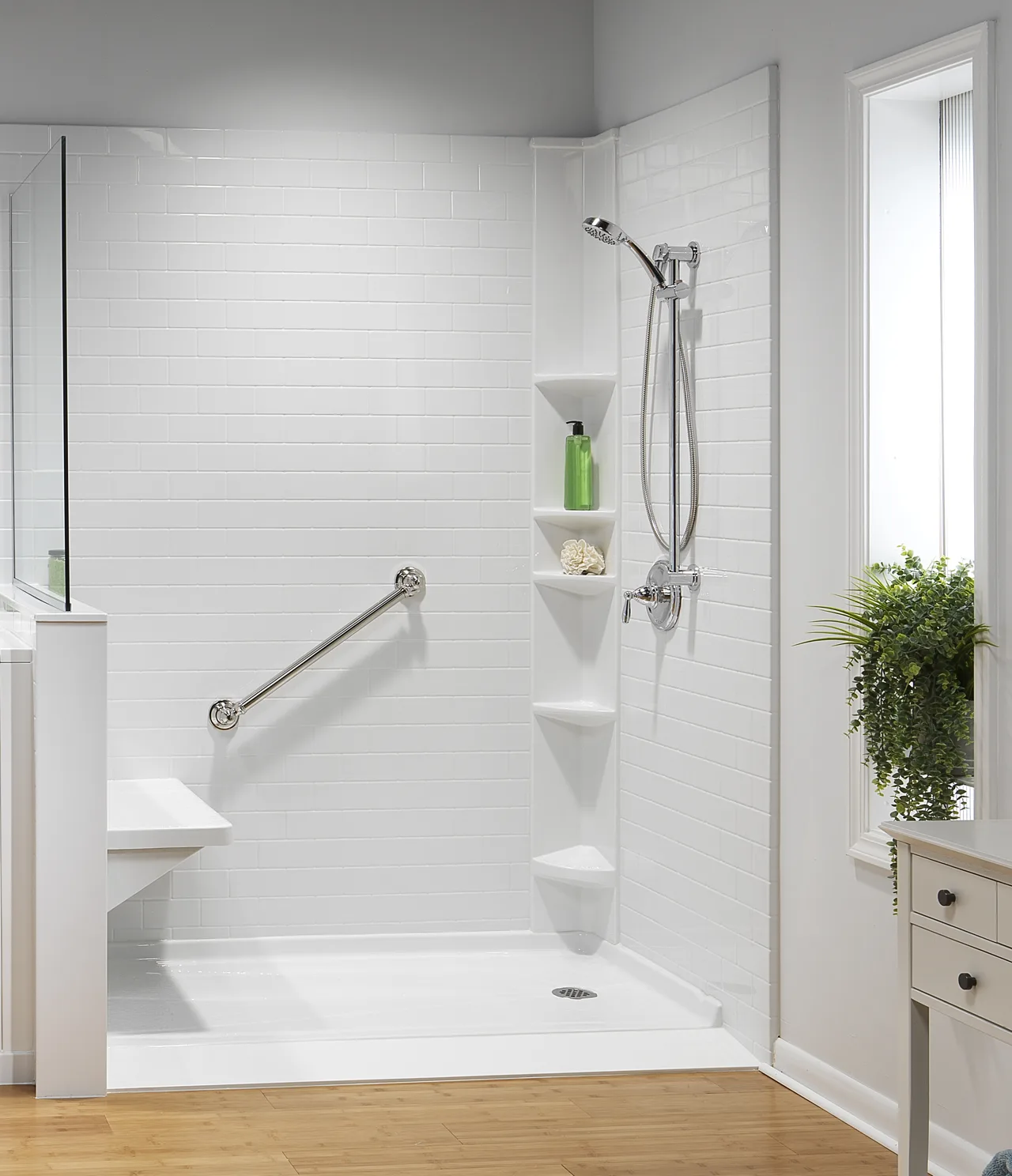 Low-threshold shower with grab bars and a seat