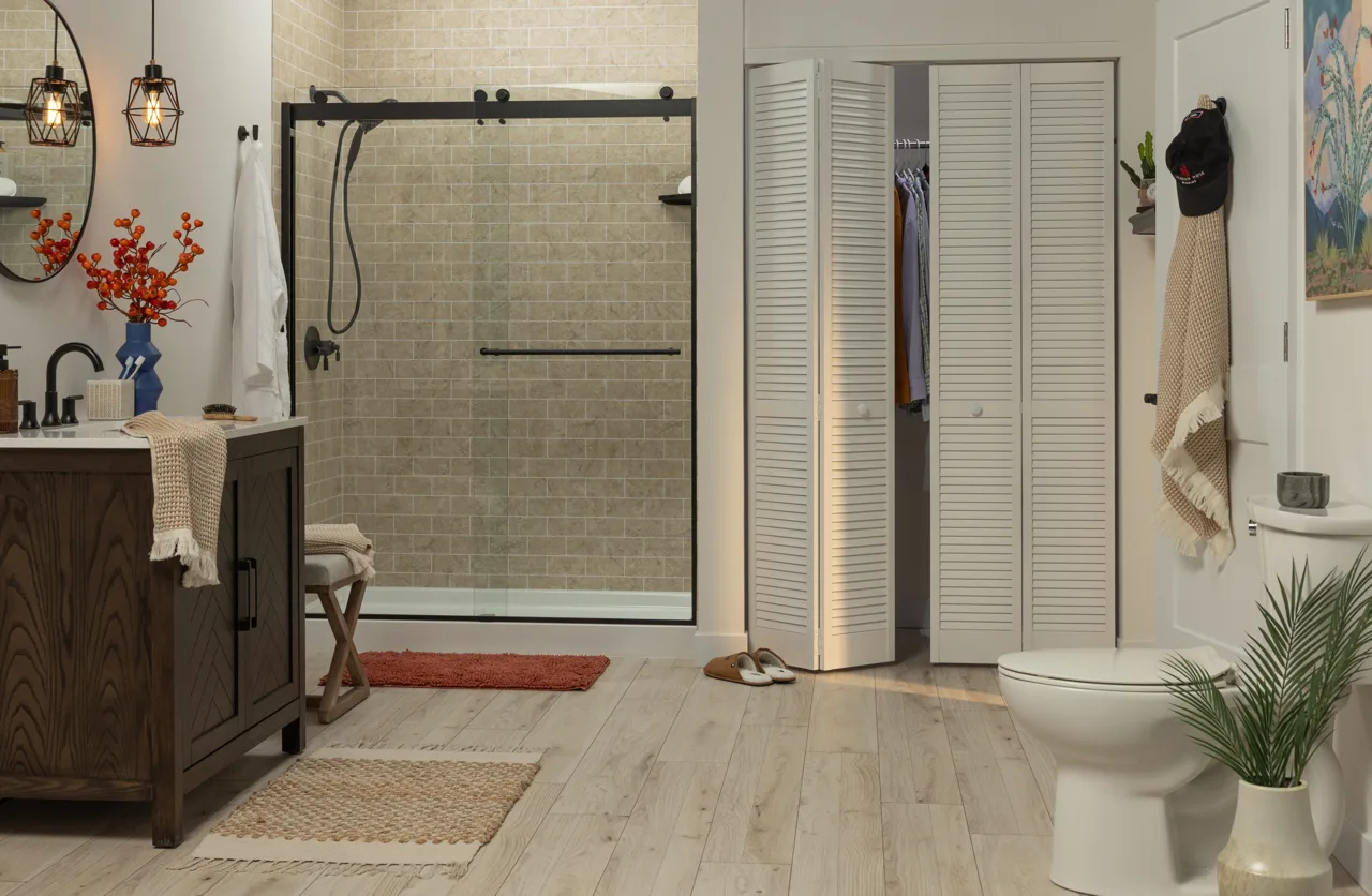 Shower with breccia stone-look walls and a glass door